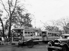 Scene on the road in Calcutta, India (based on the Dhar and Mondal Bros. Machineries" sign on the trolley). In the CBI during WWII.
