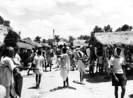 A market in India (or Burma) on a hot day during WWII.