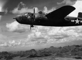 An unidentified B-25H of 491st Bm Sq in formation flight somewhere over karst formations in SW China. Photo was taken from the right, waist gun position of an aircraft.