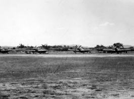 A row of P-51s in the CBI.  From the collection of Wozniak, combat photographer for the 491st Bomb Squadron, in the CBI.