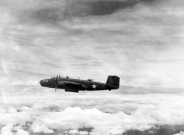 This unidentified B-25C has its bomb bay doors open as the formation approaches a target somewhere in Burma.  From the collection of Wozniak, combat photographer for the 491st Bomb Squadron, in the CBI.