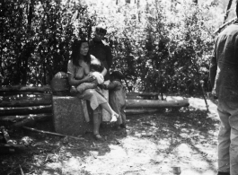 Local people in China: A woman feeds a baby. During WWII.  From the collection of Eugene T. Wozniak.