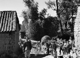 Local people in China: People on a path in a village in Yunnan, China, during WWII.  From the collection of Eugene T. Wozniak.