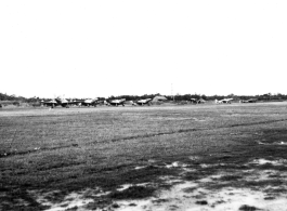 A row of P-51s in the CBI during WWII.  From the collection of Wozniak, combat photographer for the 491st Bomb Squadron, in the CBI.