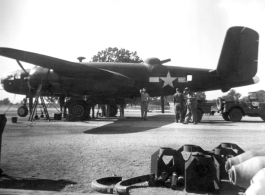 A B-25 under maintenance in the CBI during WWII. Notice the canvas cover over the turret on the fuselage.  From the collection of combat photographer Eugene T. Wozniak, 491st Bomb Squadron.