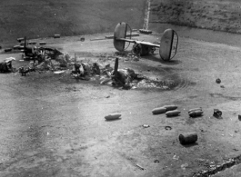 "What One Small Fragmentation Bomb Could Do--This B-24 was hit with one small fragmentation bomb during one of the nightly air raids at Luichow [Liuzhou], China.This particular plane just happened to be a new B-24 that had never flown a mission. As bad as it looks it was not a total loss since the engines were removed, inspected and run-outs done on the crankshafts to be sure they were not damaged. All the engines were used to replace blown engines on the B-24's that were flying gas into China from India. T