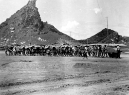 Yang Tong Airbase In 1944:"All the runways in China were made of crushed stone. They started the base with the larger stone and each layer that was added was of a smaller stone. The final layer of the runway surface was was made of finely crushed stone that was rolled and rerolled by Chinese coolies pulling a huge stone roller as shown in this picture. One of the big problems with our runways was the larger stone kept working their way to the surface and the runways had to be constantly policed to remove th