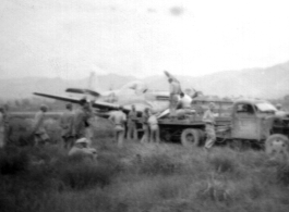 12th Air Service Group mechanics salvage a P-51 fighter in China during WWII.