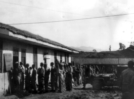 GIs line up at base supply at a base in China during WWII.