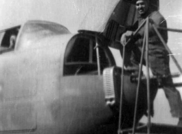 An American armorer prepares a B-25. In China during WWII.