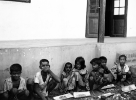 Local kids--with portions of food--in India during WWII.