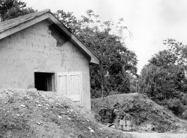 A newly built building at a base in China during WWII. Note the raise protective berm around the building, to protect from bomb blasts, etc.