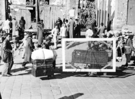 People transporting possessions in Guilin during WWII, possibly in preparation to fleeing in the face of the Japanese Ichigo campaign.