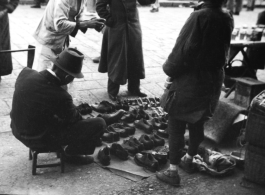 A street-side shoe vendor in China during WWII.  From the collection of Hal Geer.