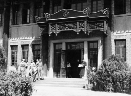 American GIs loiter outside an official looking building in China during WWII.