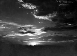 Tents for GIs at the American base at Liuzhou during WWII, silhouetted against the sunset.