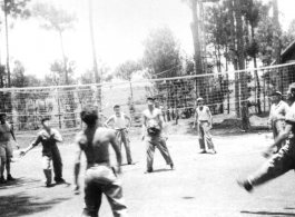 GIs play volleyball. in Yangkai, China, 1944. Art, Gross, Trombley, Kainne [Keiser?], Elmer Moore, Harry Leech, Lacher [or Lecher?], Alelunas, Doc Townsend  From the collection of Frank Bates.