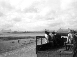 Chinese workers riding transport on the US air base at Liuzhou. During WWII.  From the collection of Frank Bates.