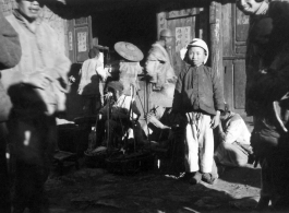 Three old men and a boy with new clothes, Yangkai Village, Spring 1945  From the collection of Frank Bates.