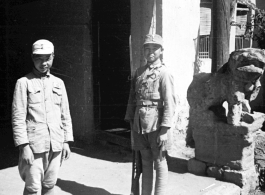 Two very young Chinese soldiers keeping guard in SW China during WWII.