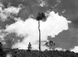 An American GI out walking with his trusty carbine in Yunnan province, China.