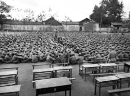 Chinese soldiers sitting during rally in southern China.