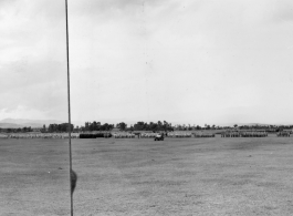 Panorama of Chinese soldiers in numerous ranks during exercises in southern China, probably Yunnan province, or possibly in Burma.