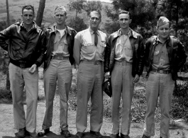 American flyers at Yangkai make poses for the camera, including with a senior officer. During WWII.