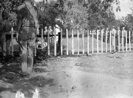 Solemn burial ceremony for American GIS who had died at a temporary war-time graveyard. In the CBI, during WWII.