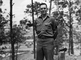 Eugene Wozniak poses among pines at Yangkai air base during WWII.