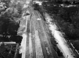 Large crater and tracks shifted wholesale during bombing on Phu Lang Thuong railway bridge over the Thuong River at Bắc Giang City in French Indochina (Vietnam), during WWII. In northern Vietnam, and along a critical rail route used by the Japanese.  Coordinates:  21°16'32.69"N 106°11'9.28"E  The low level that these B-25 crews flew at times is truly remarkable, as evidenced in this image.