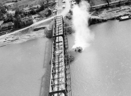 Bombing of Đò Lèn Bridge in Hà Trung Town in French Indochina (Vietnam), during WWII. In northern Vietnam, and along a critical rail route used by the Japanese.