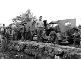 A convoy of mud-covered Jeeps in southern China.