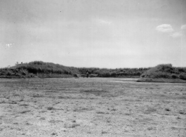 16CU Oct 20th, 1944 N-24 Revetment  A P-51 fighter plane in a forlorn revetment in the CBI during WWII.