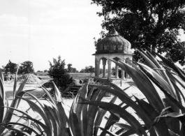 A small stone pavillion in the countryside.  Scenes in India witnessed by American GIs during WWII. For many Americans of that era, with their limited experience traveling, the everyday sights and sounds overseas were new, intriguing, and photo worthy.