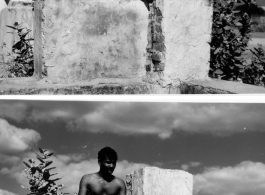 Man sits cross-legged on stone.  Scenes in India witnessed by American GIs during WWII. For many Americans of that era, with their limited experience traveling, the everyday sights and sounds overseas were new, intriguing, and photo worthy.