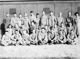 A group of trainees in photography during WWII.  Edward H. Dixon is sitting crossed-legged in the first row, second from the left.