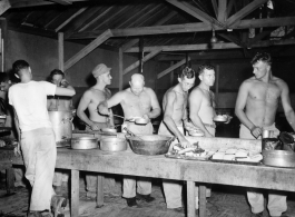 GIs of the 797th Engineer Forestry Company in Burma, getting chow.  During WWII.