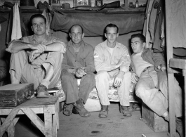 Engineers of the 797th Engineer Forestry Company pose in their barracks in Burma.  During WWII.