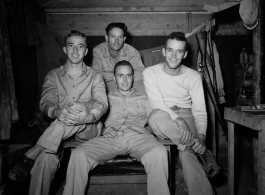 Engineers of the 797th Engineer Forestry Company pose in their barracks in Burma.  During WWII.