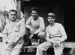 Engineers of the 797th Engineer Forestry Company pose outside building at camp in Burma.  During WWII.