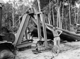 797th Engineer Forestry Company in Burma, loading logs for milling for bridge building along the Burma Road.  During WWII.