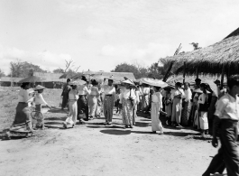 Ladies dressed in finery at an activity in Burma.  In Burma near the 797th Engineer Forestry Company.  During WWII.