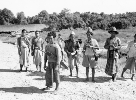 Kachin men on road in Burma.  Near the 797th Engineer Forestry Company.  During WWII.