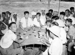 Men gambling at an activity in Burma.  In Burma near the 797th Engineer Forestry Company.  During WWII.