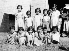 Local kids at a school (likely a missionary school) in Burma.  In Burma near the 797th Engineer Forestry Company.  During WWII.