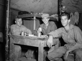 Engineers of the 797th Engineer Forestry Company pose in their barracks in Burma.  During WWII.