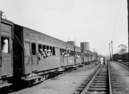 GIs on train in Burma or India.  Near the 797th Engineer Forestry Company.  During WWII.