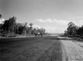 A B-25 on an airstrip in Burma.  Aircraft in Burma near the 797th Engineer Forestry Company.  During WWII.