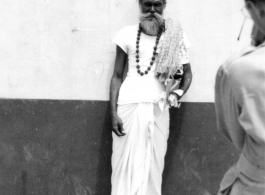 A GI takes picture of sadhu in India, as seen by men of the 2005th Ordnance Maintenance Company, 28th Air Depot Group, in India during WWII.